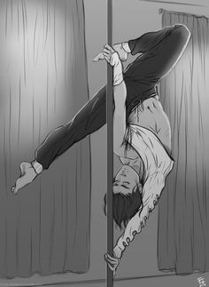 a man hanging upside down on a pole