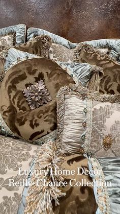 a bed with many pillows on it and the words luxury home decor relix creative collection