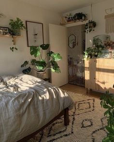 a bedroom with lots of plants on the wall