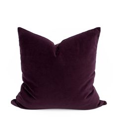 a purple pillow on a white background