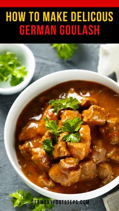 a white bowl filled with stew and garnished with cilantro on the side