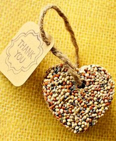 an image of a bird seed heart ornament with the words love on it