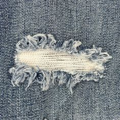 an old pair of jeans with fray edges