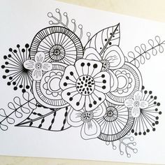 a black and white drawing of flowers on paper