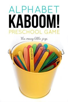 a yellow bucket filled with colored pencils and the words alphabet kaboom preschool game