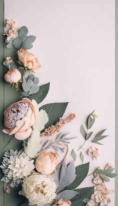 an arrangement of flowers and greenery on a white background with green leaves, pink peonies and other flowers