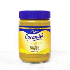 a jar of caramel honey spread sitting on a counter