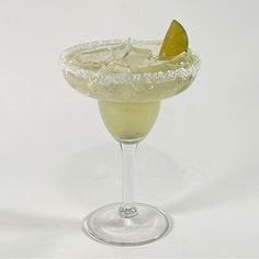 a margarita cocktail with an orange slice on the rim