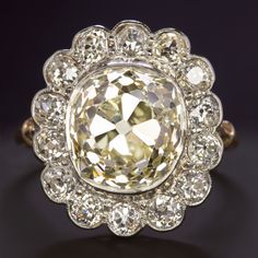 Why we love it:This glamorous vintage diamond ring has an absolutely jaw-dropping large look with a huge 6.28ct old mine cut diamond center surrounded by a chunky old cut diamond halo! It is an absolutely stunning rare find!Highlights:- Original vintage- Very large and impressive 6.28ct old mine cut center diamond- Gorgeous elongated old mine cut!- Beautiful light yellow hue with W-X color. It contrasts beautifully with the white diamond halo- 100% eye clean with SI1 clarity- Very substantial di Vintage Diamond Ring, Antique Engagement Rings Vintage, Old Mine Cut Diamond, Platinum Rose Gold, Vintage Engagement Ring, Diamond Engagement Rings Vintage, Vintage Diamond Rings, Big Rings, Ring Ideas