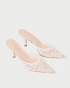 Step into elegance with the Layla White Lace Mule, a heeled mule crafted in delicate white lace mesh. Featuring a pointed toe, padded leather footbed, and easy slip-on style, this 3-inch heel offers a refined touch for any sophisticated ensemble. Heeled Mule, 3 Inch Heels, Mule, White Lace, Clogs, Slip On, Mesh, Heels, Lace