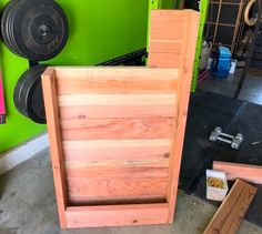 a bench made out of plywood and some other wood planks in a garage