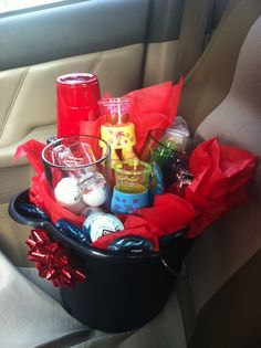 a car filled with lots of different things in it's back seat and some red tissue