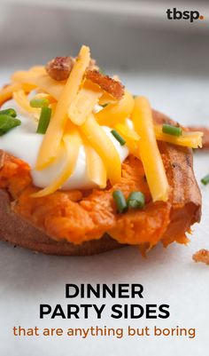 a baked potato topped with cheese and green onions