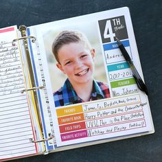 an open notebook with a child's photo on it