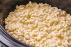 macaroni and cheese is being cooked in the slow cooker