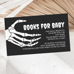 a black and white sign that says books for baby on it's back side