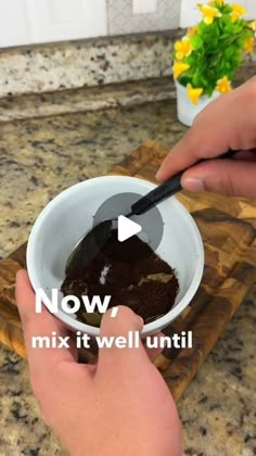 someone is mixing chocolate in a bowl with a spoon