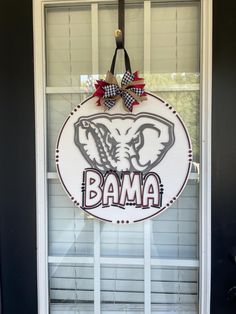 a door hanger with the word obama on it and an elephant's head