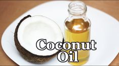 coconut oil on a white plate next to an open coconut