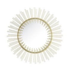 a round mirror with gold lines on it