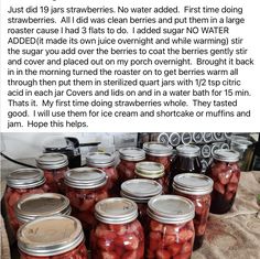 some jars filled with pickles sitting on top of a table