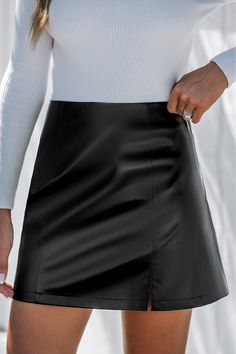 Channel your inner rock star with the Black Faux Leather Notched Hem Mini Skirt. The edgy faux leather and notched hem give you a rebellious vibe while keeping it chic. Product code: CAA02B4J008AA Features:  Woven Notched hem Mini Wash Method: Hand Wash Lining: 100%POLYESTER Material: 50%POLYURETHANE,50%POLYESTER. Solid Color Faux Leather Mini Skirt, Fitted Faux Leather Lined Mini Skirt, Trendy Faux Leather Pencil Skirt, Fall Faux Leather Pencil Mini Skirt, Faux Leather Mini Skirt For Party, Fall Faux Leather Mini Skirt, Rock Style Fall Skirt, Fitted Faux Leather Pleated Skirt, Rock Style Mini Skirt For Fall Night Out