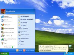 the windows xp desktop is running with blue sky and clouds