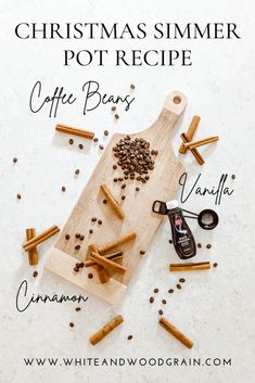 a wooden cutting board topped with coffee beans and cinnamons