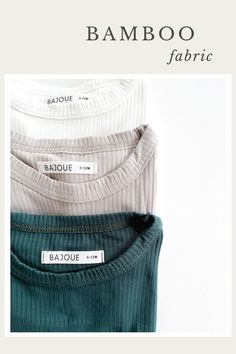 three different colored shirts are stacked on top of each other, with the words bamboo fabric written