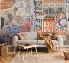 a couch sitting in front of a wall covered with old baseball posters on it's walls