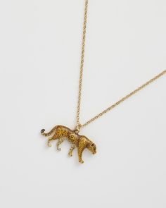 Embrace the wild elegance of our Leopard Pendant Necklace. This hand-painted enamel charm on a delicate chain symbolises power and grace. Ideal for adding a touch of the exotic to your attire, it channels the leopard’s fierce independence and sophistication, perfect for your cultural explorations.


Key features:


Pendant: 18ct High polish gold plated brass, zinc alloy, enamel 
Chain: 18ct High polish gold plated brass



41cm (16"") Chain with 5cm (2"") extender; Pendant: 17mm height x 24mm wi Leopard Necklace, Animal Bracelet, Luxury Christmas Gifts, Talisman Necklace, Gold Plated Bangles, The Leopard, Animal Brooch, Delicate Chain, Louis Vuitton Shoulder Bag