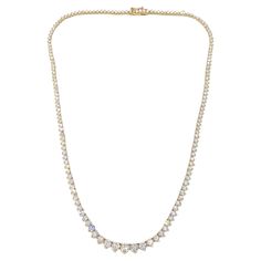 This beautiful Riviera graduated diamond tennis necklace adds grace and flair to your everyday look! The diamonds weigh a total of 10.00 carats and have SI clarity with G-H color. Each diamond is set with three prongs and sparkles brilliantly! The diamonds go all the way around the necklace making it the perfect statement piece. The solid 14-karat yellow gold necklace is lovely by itself or paired with other necklaces! We can make this beauty for you in a range of metals and colors. Just message us to ask! For orders in different metals and colors, please allow 3-5 weeks for delivery. The details for this beautiful necklace are listed below: Metal Quality: 14 karat yellow gold Chain Length: 17 inches Clasp Type: Box with safety latch Diamond Shape: Round brilliant cut Diamond Total Weight: Diamond Tennis Necklace, Heirlooms Jewelry, Tennis Necklace, Star Jewelry, Name Jewelry, Rings Cool, Yellow Gold Chain, Jewelry Companies, Designer Engagement Rings