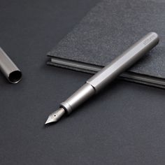 a pen sitting on top of a notebook