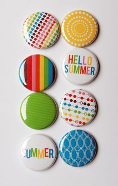 six buttons with the words hello summer in different colors and designs, all on a white surface