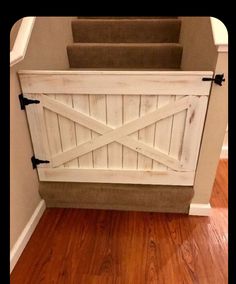 a white barn door on the side of a wall