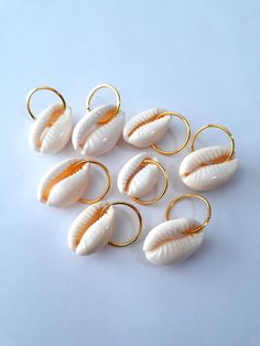 Set of 8 natural cowrie shells on brass hair rings.  Rings fit all locs and braids. Hair Shells Braids, Shell Braided Hair, Shells For Locs, Loc Rings, Hair Shells, Charms For Braids, Shells In Braids, Hair Shells Locs, Cowries On Hair