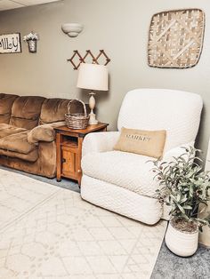 a living room with two couches, a chair and a coffee table in it