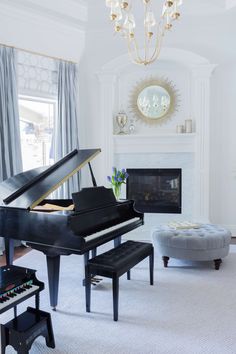 a living room with a grand piano in it