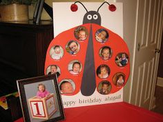 a ladybug birthday card and photo frame on a table