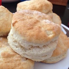 several biscuits are stacked on top of each other in a white plate and ready to be eaten