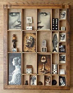 a wooden box filled with lots of different types of items on top of a table