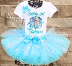 the birthday girl is wearing a blue and white frozen princess tutule skirt with matching t - shirt