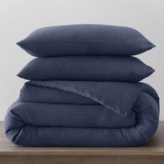 three pillows stacked on top of each other