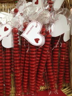 some red candy sticks with hearts on them