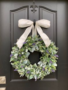 a wreath is hanging on the front door