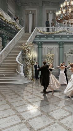 the bride and groom are dancing together in front of their guests at an elegant wedding