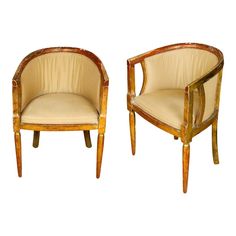 a pair of wooden chairs sitting next to each other