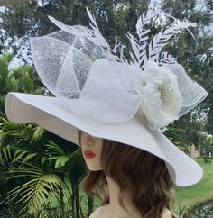 Step into the world of elegance ad tradition with this exquisite Ketucky Derby wide brim hat.  Handcafted with the finest materials, the hat boasts a wide brim that gracefully frames your face creating aura of sophication and charm.  Perfect for church, tea party or ay special occasion.  Available in several colors upon request. White Flower Wedding, White Fascinator, Tea Hats, Canvas Hat, Church Hat, Bridal Hat, Wedding Hat, Wedding Fascinators, Wide Brim Sun Hat