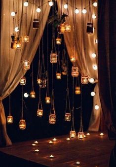 a room with lights hanging from the ceiling