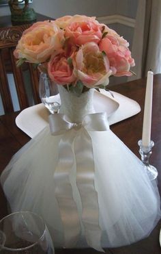 a vase filled with flowers on top of a table